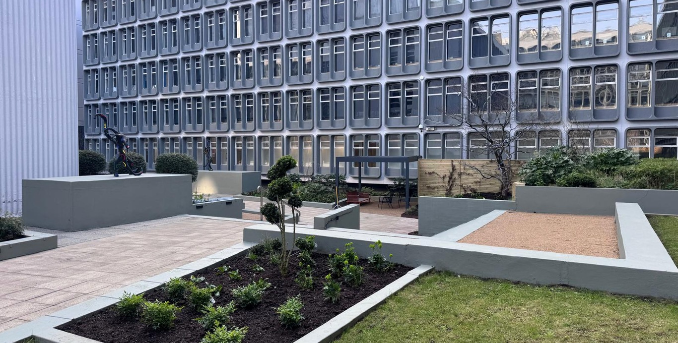 Lawns, planting and paths in the Riverside courtyard.